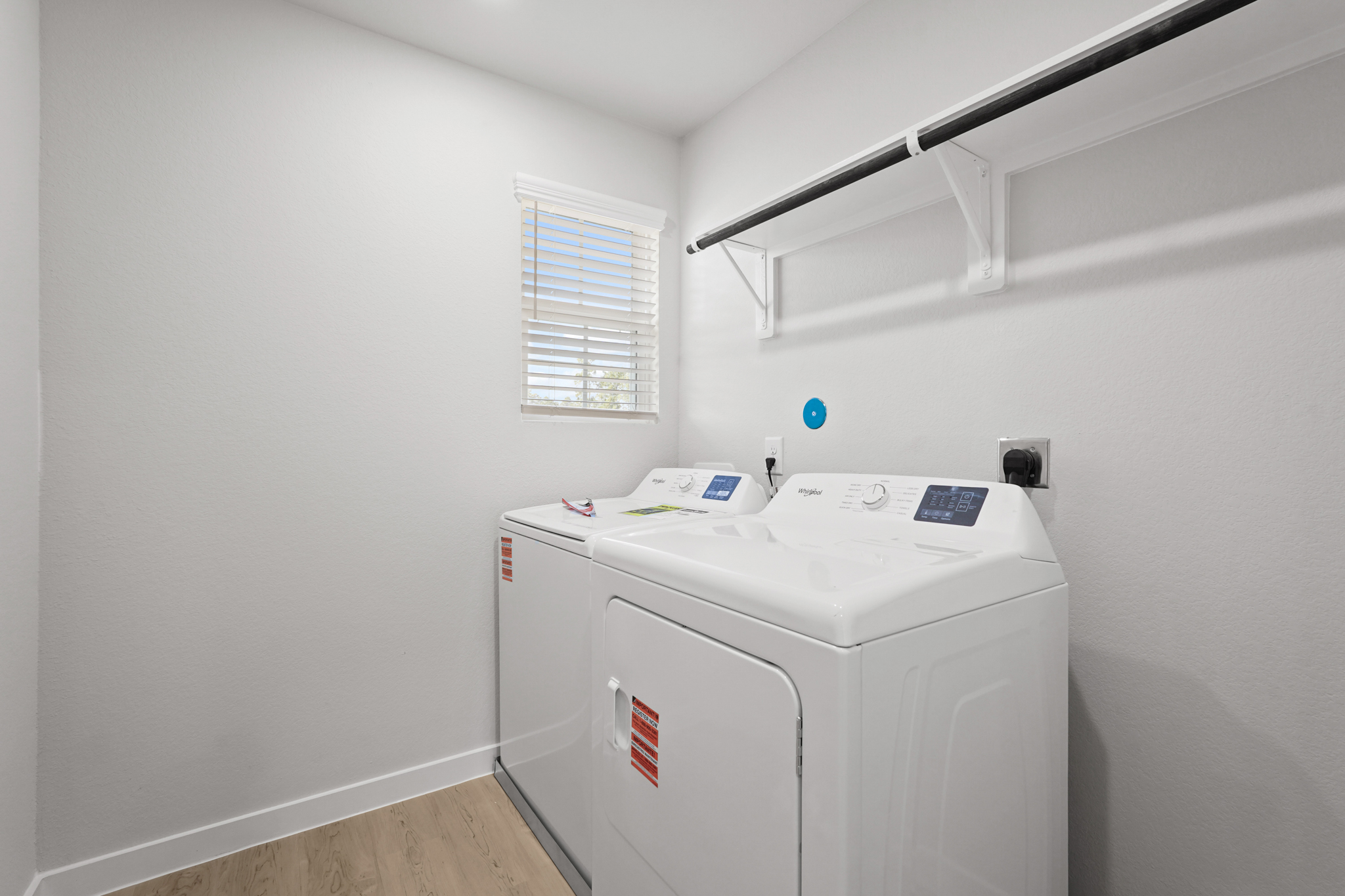 A white washing machine in a room.