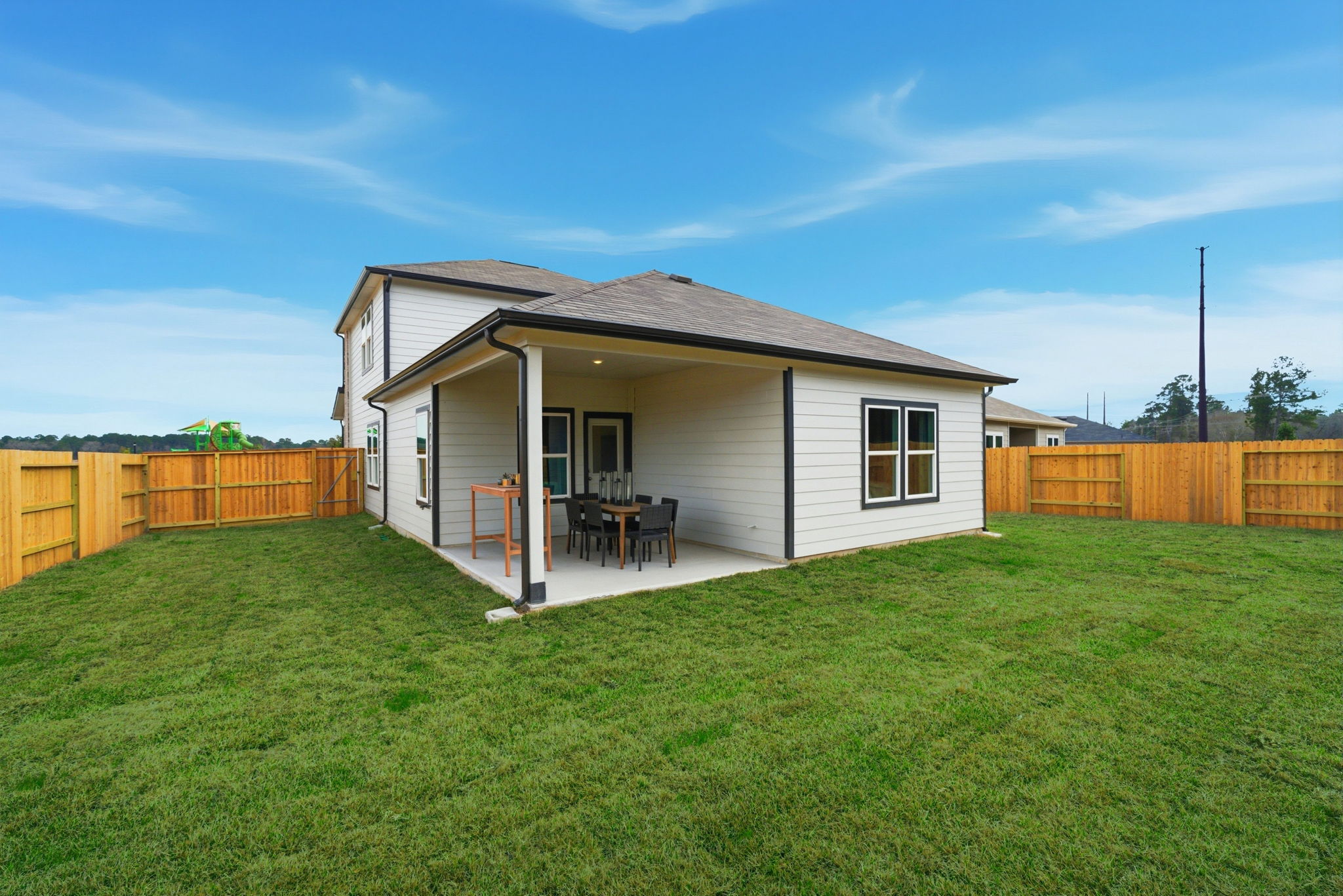 A small house with a fence.