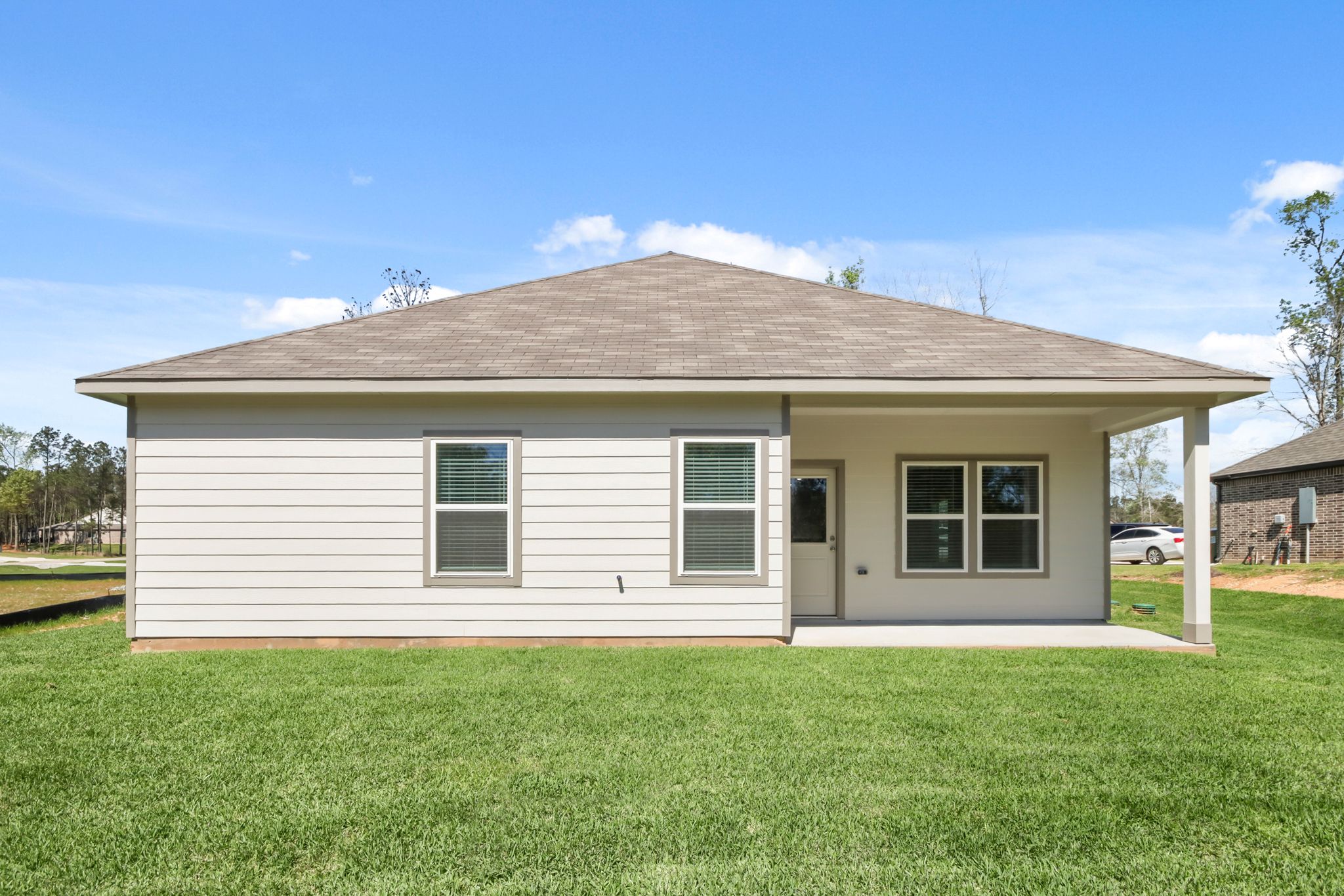 A house with a grass yard.