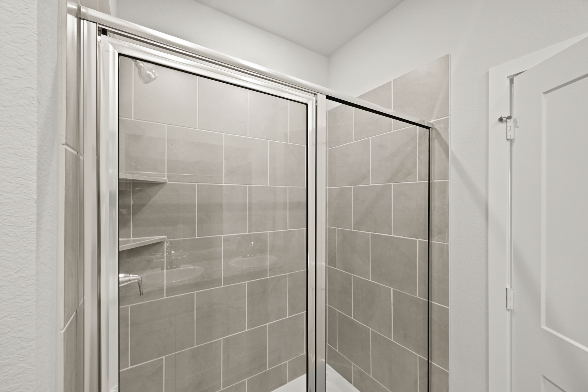 A shower unit in a bathroom.