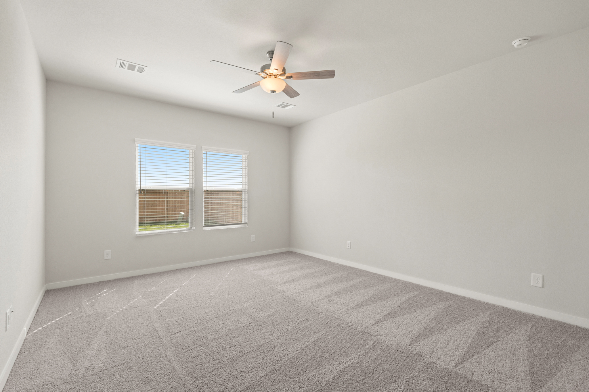 A ceiling fan in a room.
