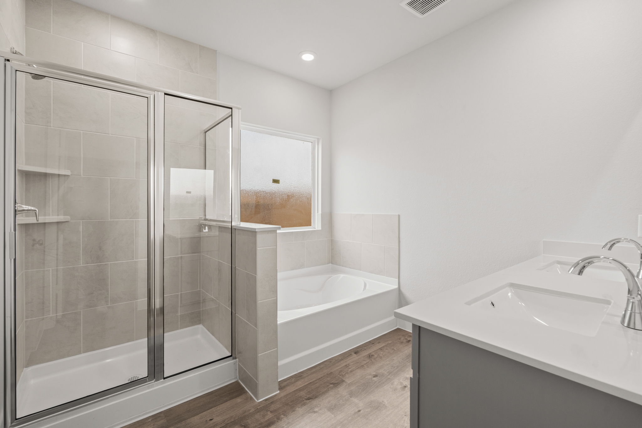 A bathroom with a glass shower.