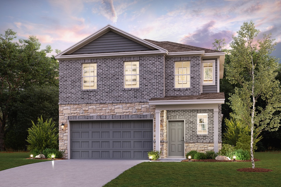 A house with a garage and trees.