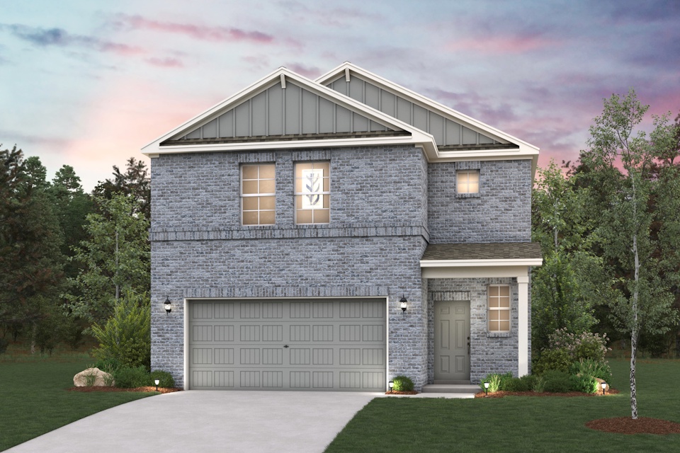 A house with a garage and trees.
