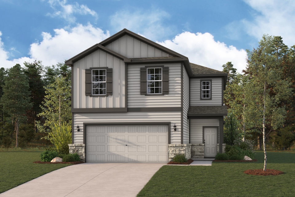 A house with a garage and trees.