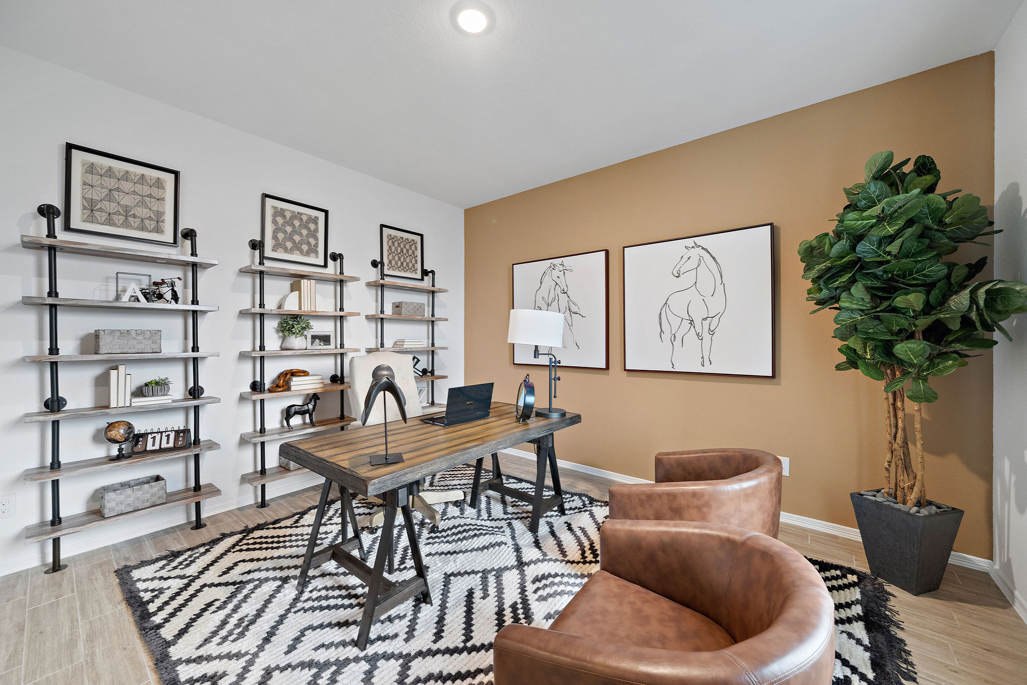 A living room with a table and chairs.