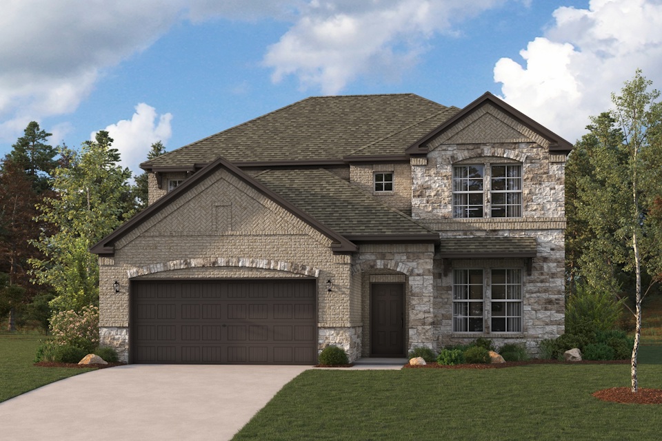 A stone house with a garage.