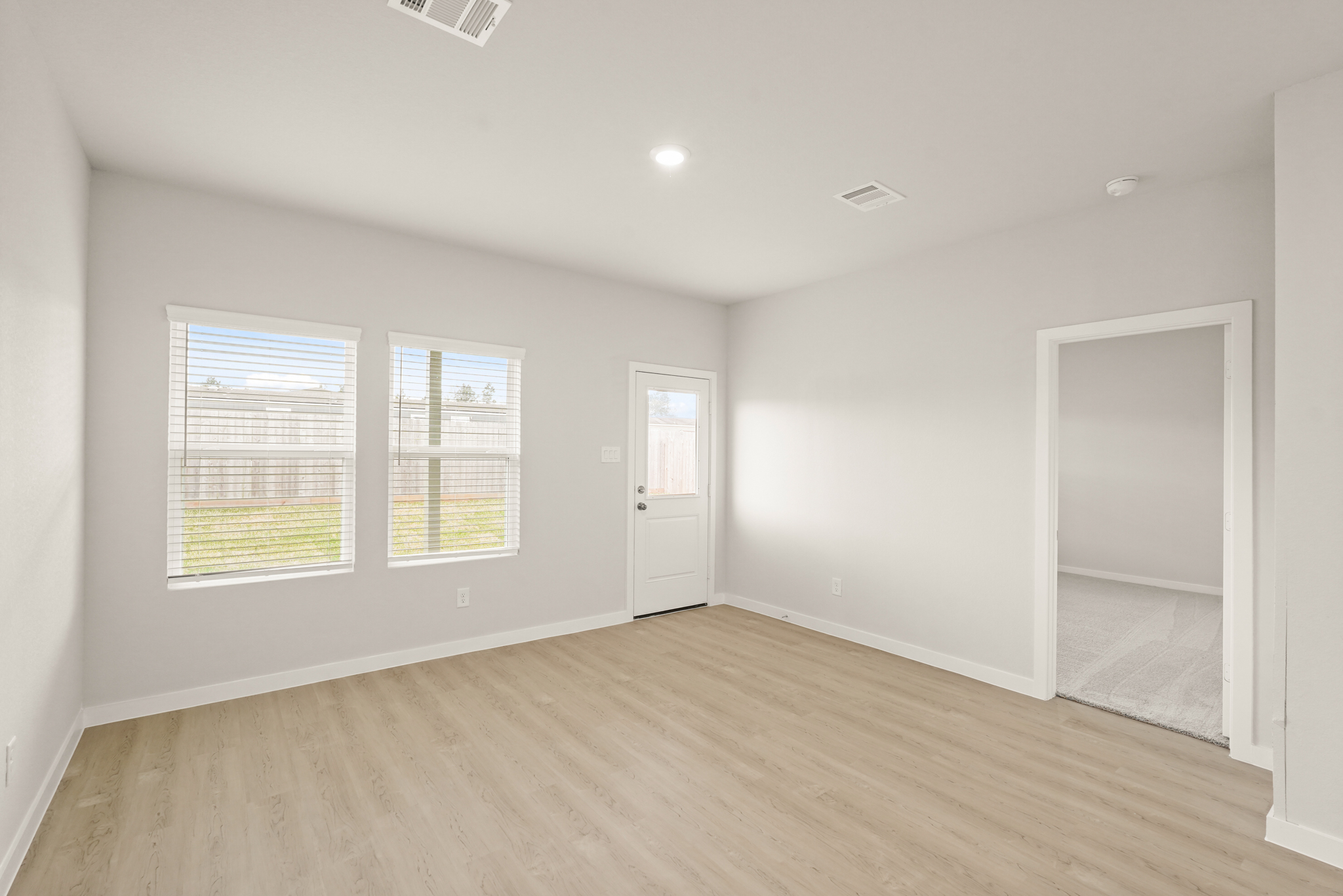 A room with a wood floor and a wood floor.
