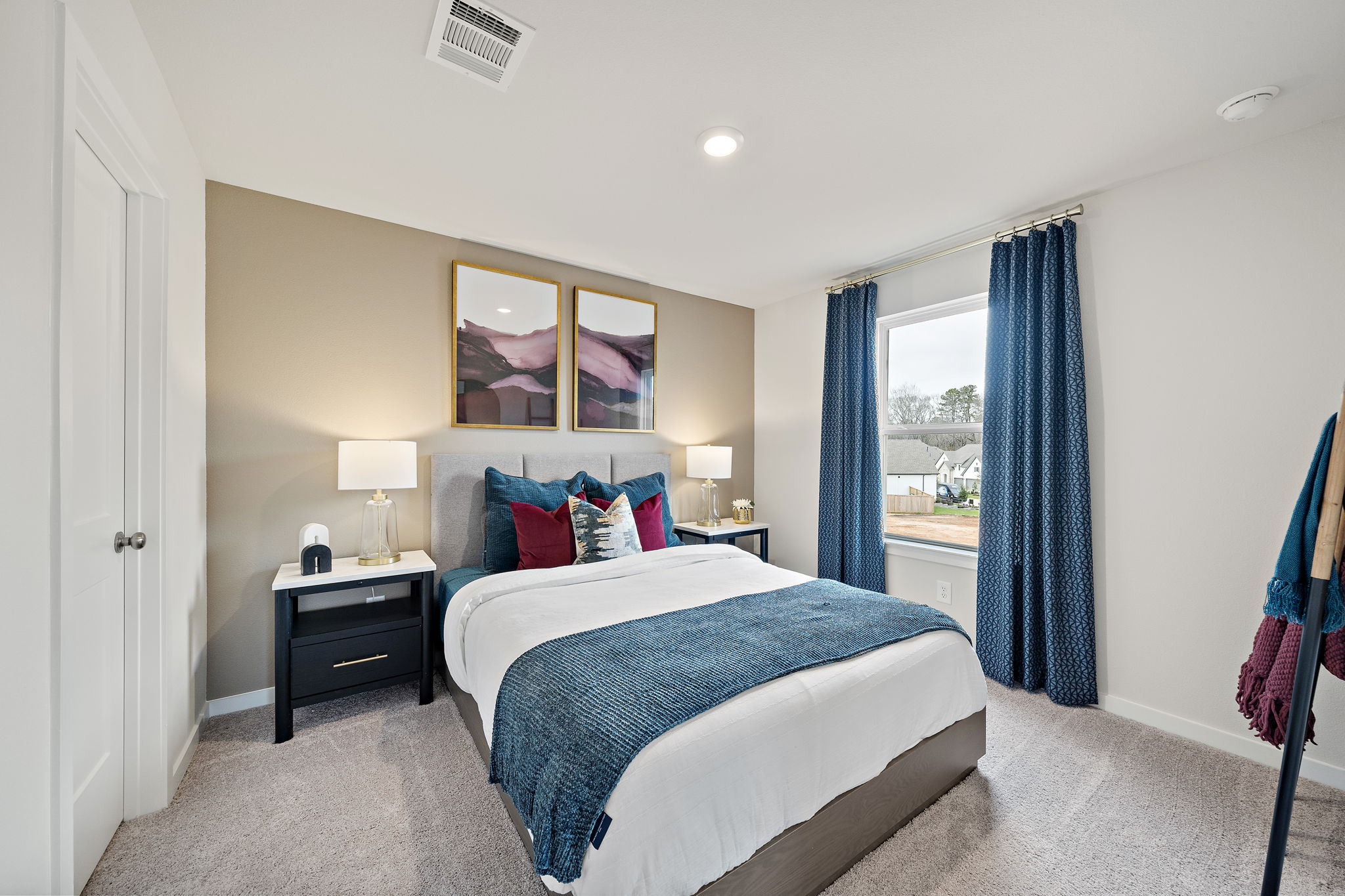 A bedroom with a large bed.