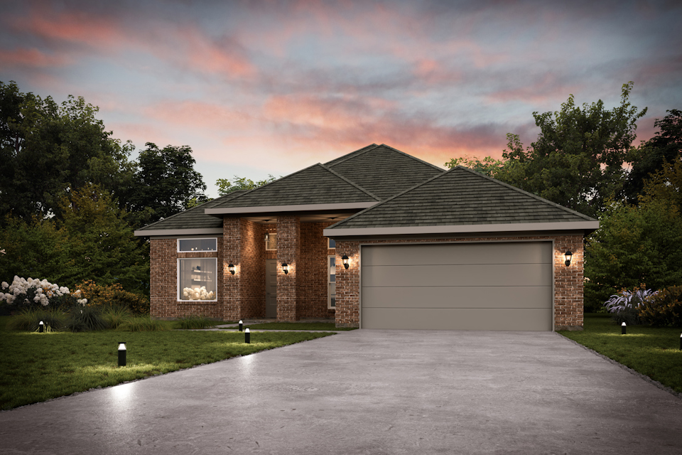 A house with a garage and trees around it.