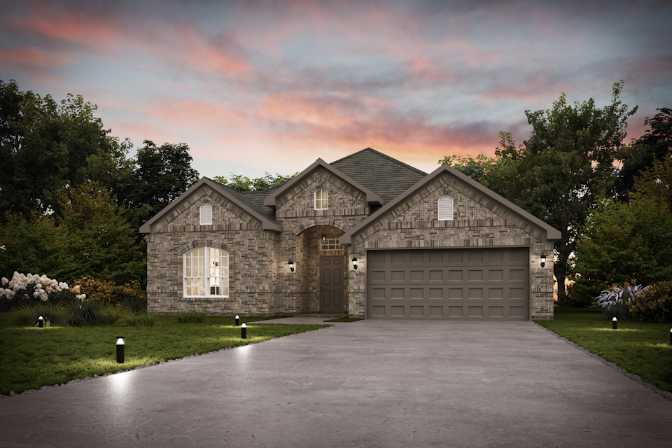 A house with a driveway and trees around it.