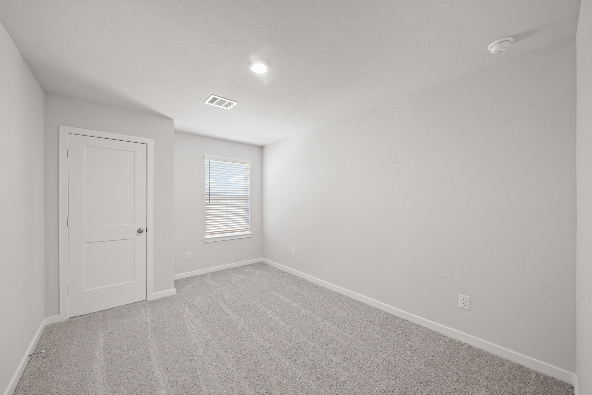 A room with a door and a window.