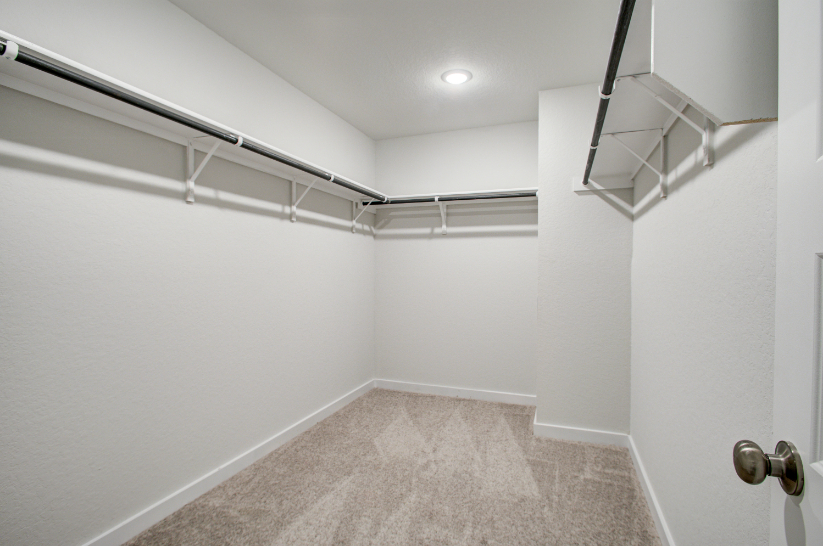 A hallway with white walls.