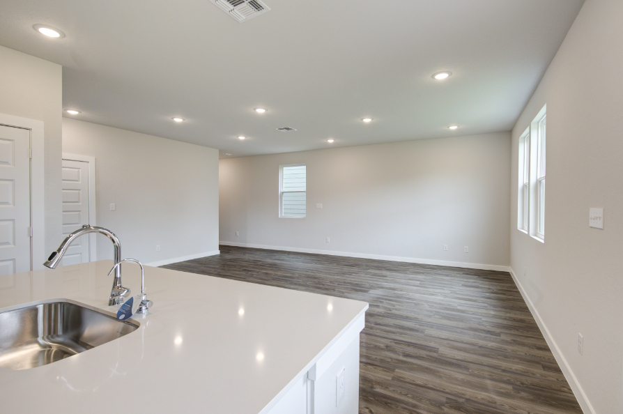 A kitchen with a marble countertop.