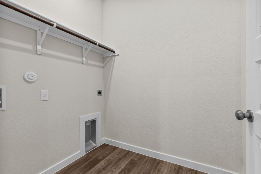 A white wall with a white door.