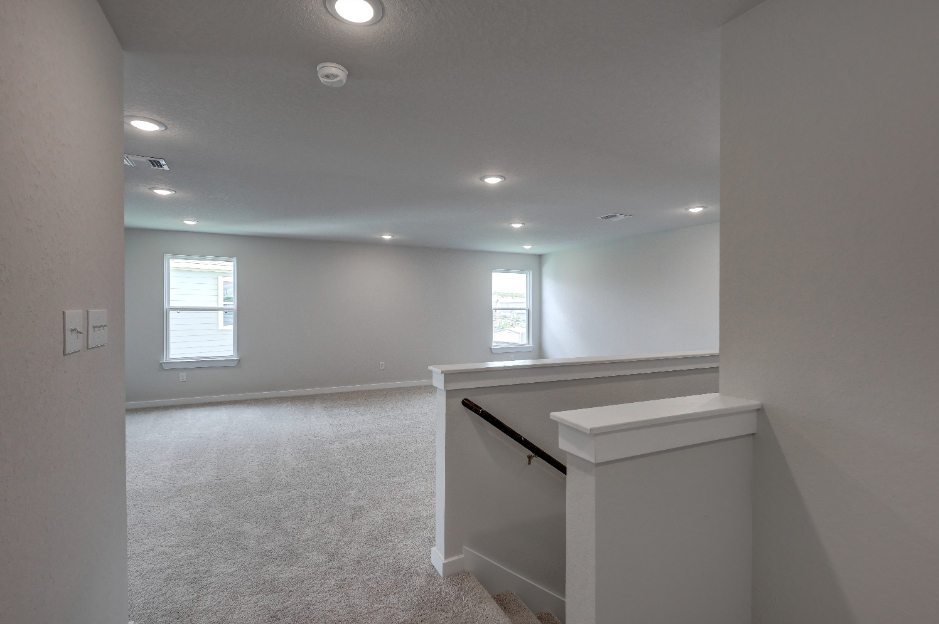 A room with a counter and a window.