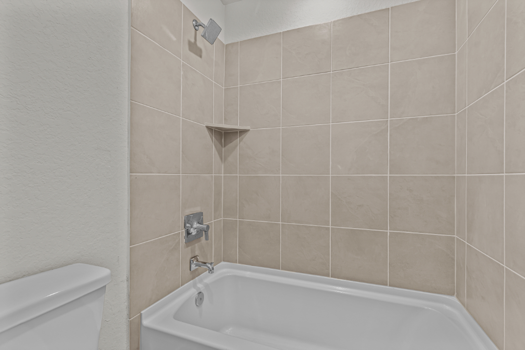 A bathtub in a bathroom.