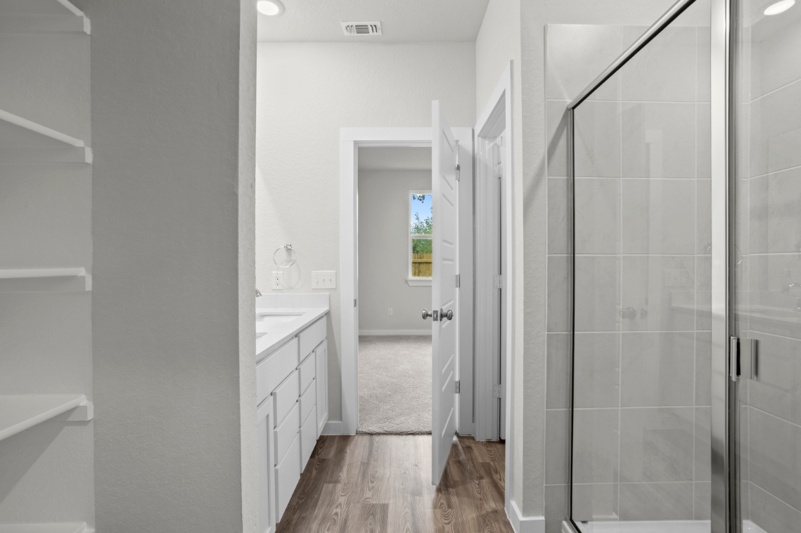A bathroom with a glass shower.