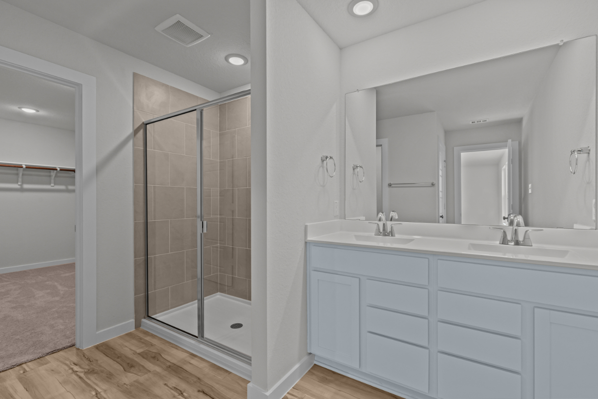 A bathroom with a glass shower.