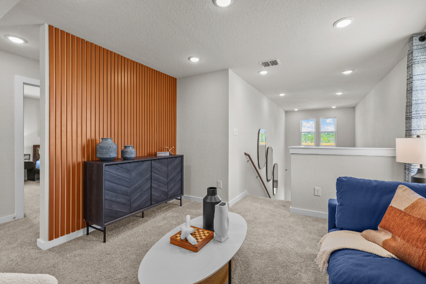 A living room with a couch and a table.