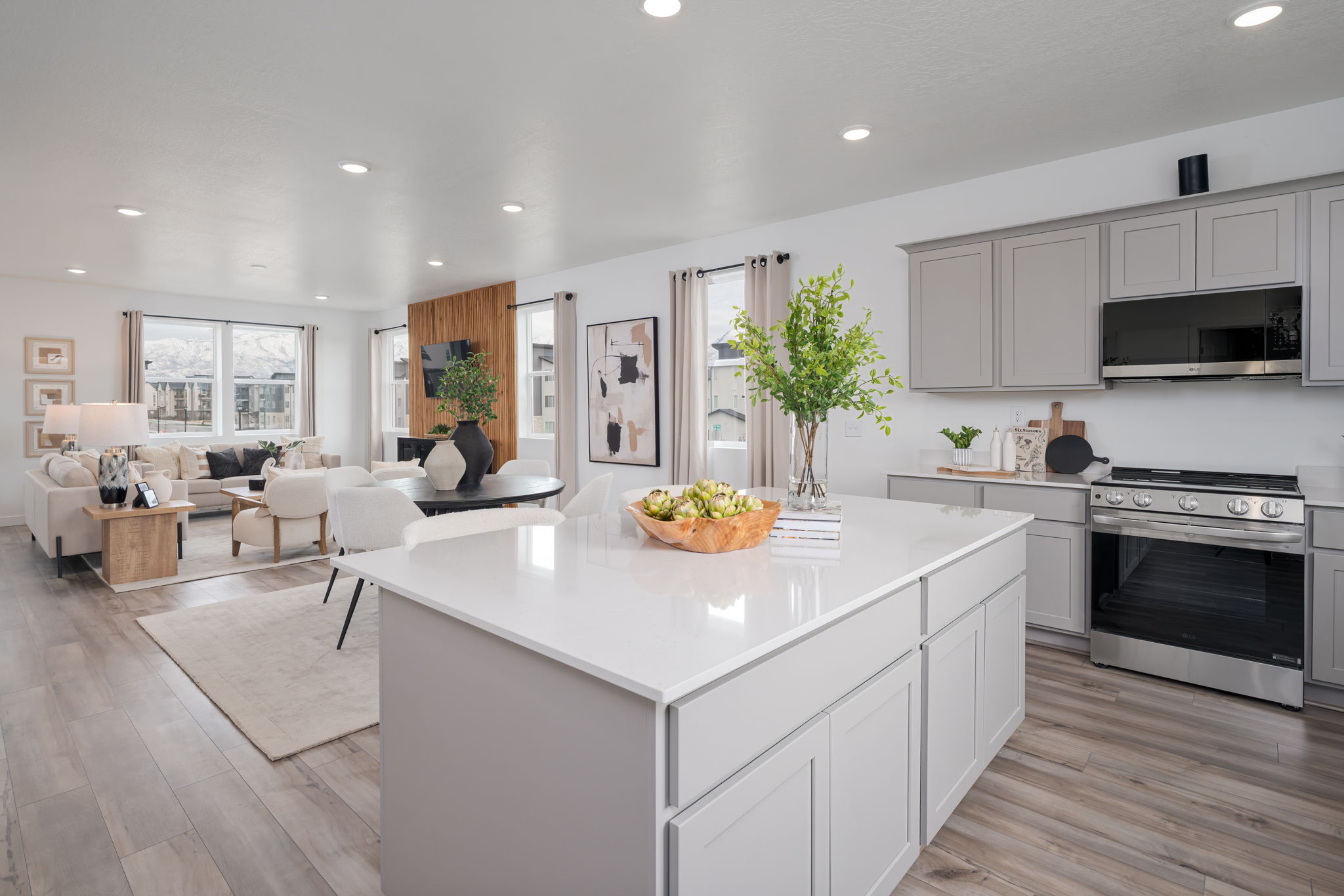 A kitchen with white cabinets.