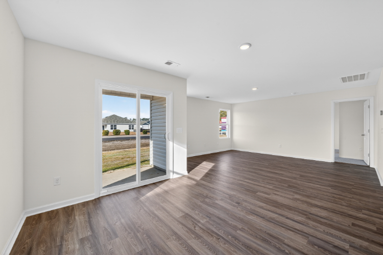 A room with a wood floor and a wood floor.