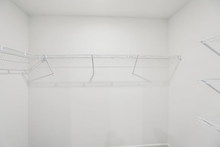 A white staircase in a room.