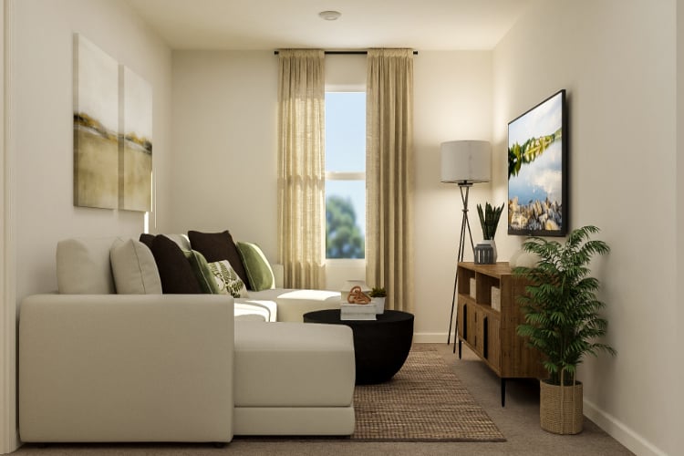 A living room with a white couch and a coffee table.