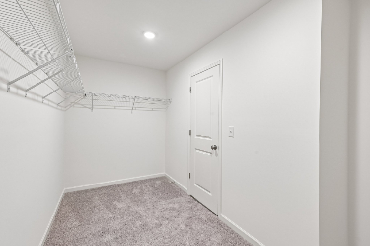 A hallway with white walls.