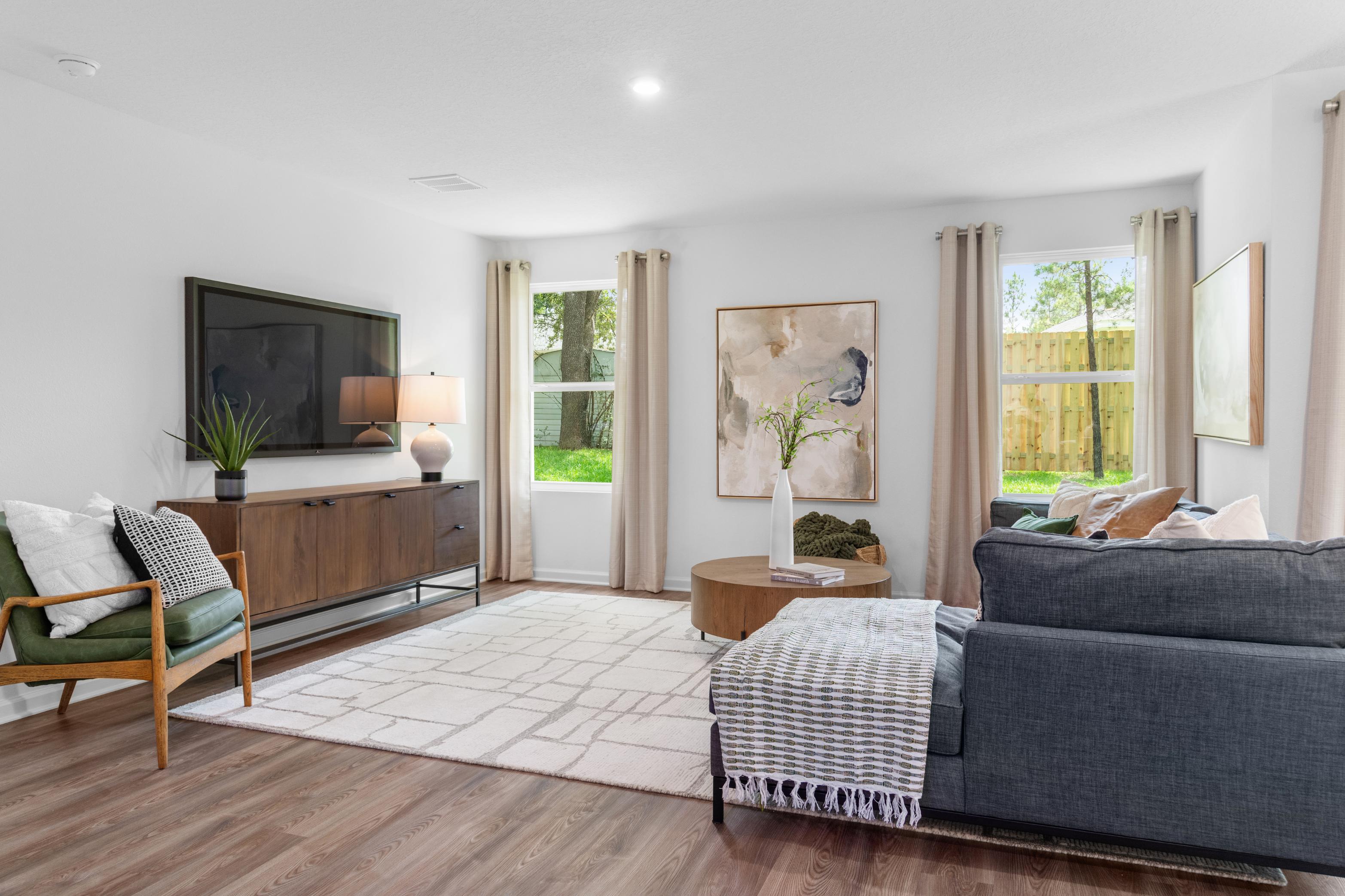 A living room with a couch and a table.
