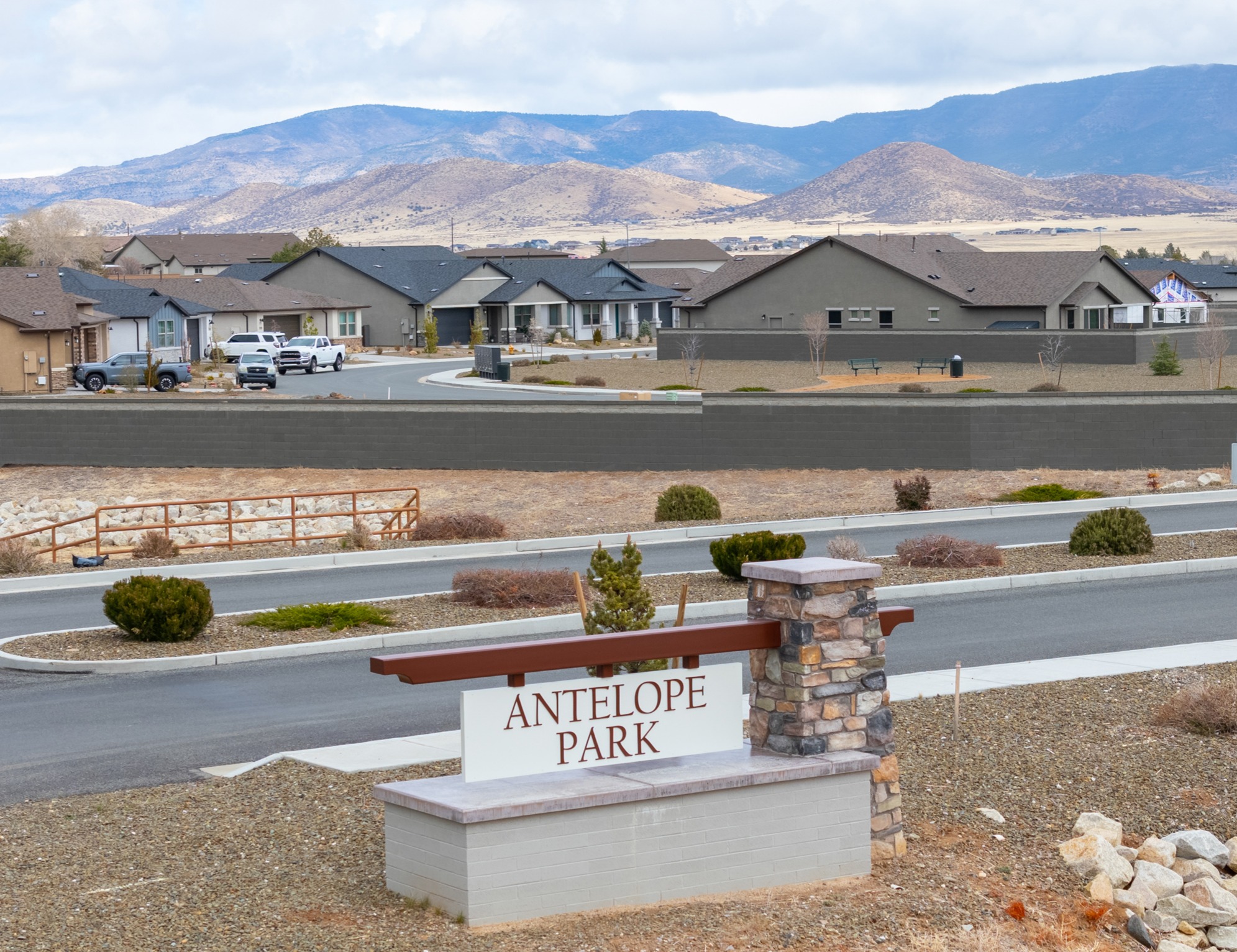 A sign in front of a road.
