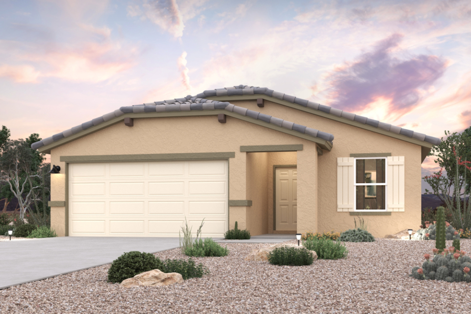 A house with a gravel driveway.