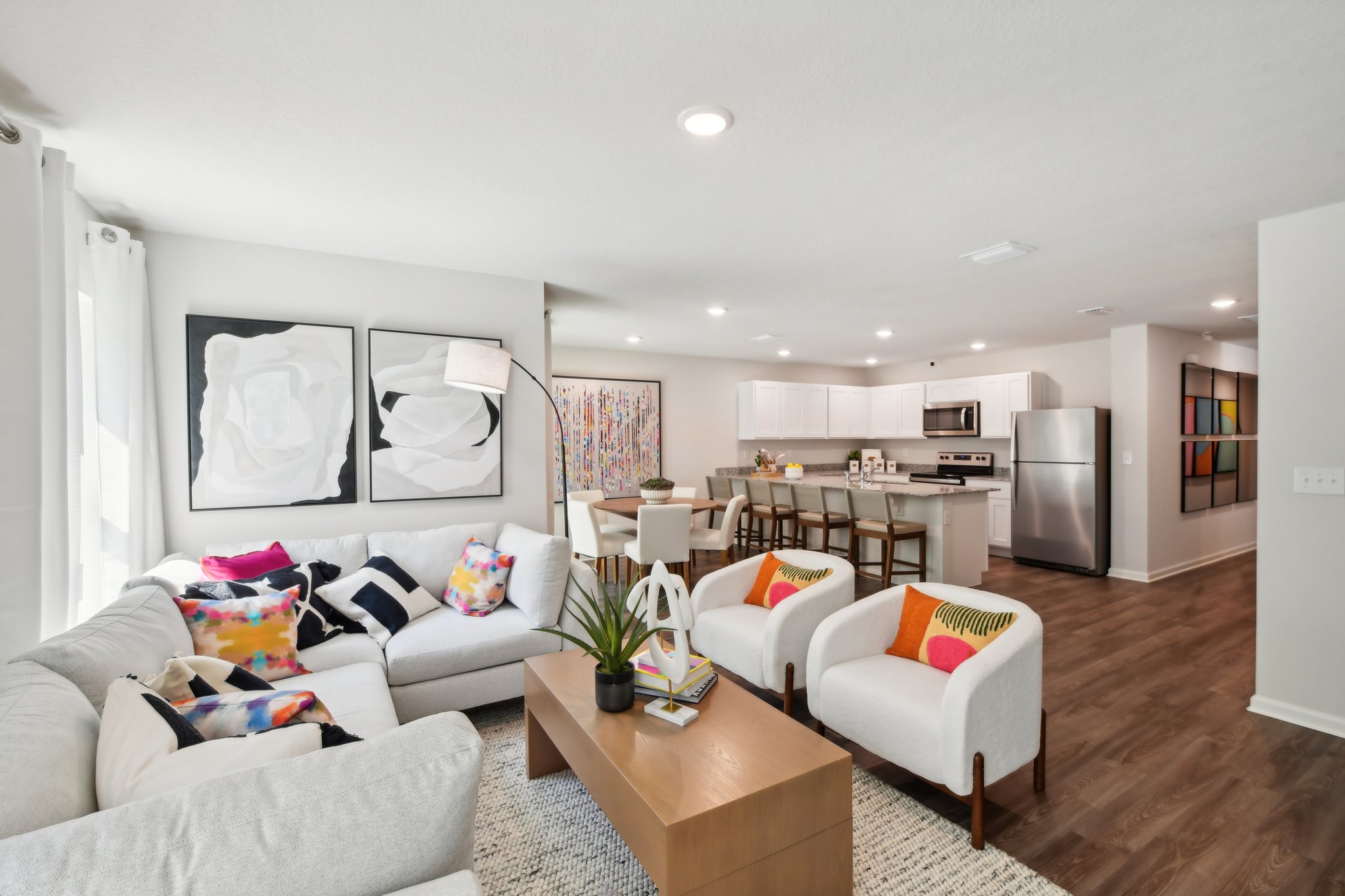 A living room with a large dining area.