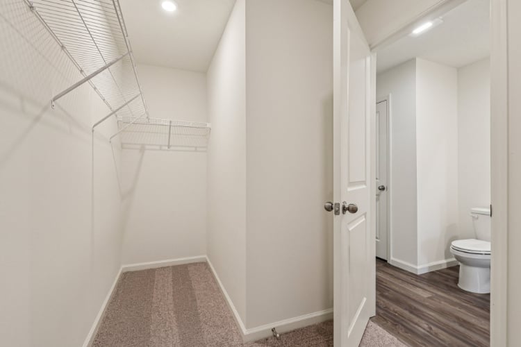 A bathroom with white walls.