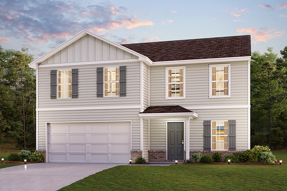 A white house with a garage.