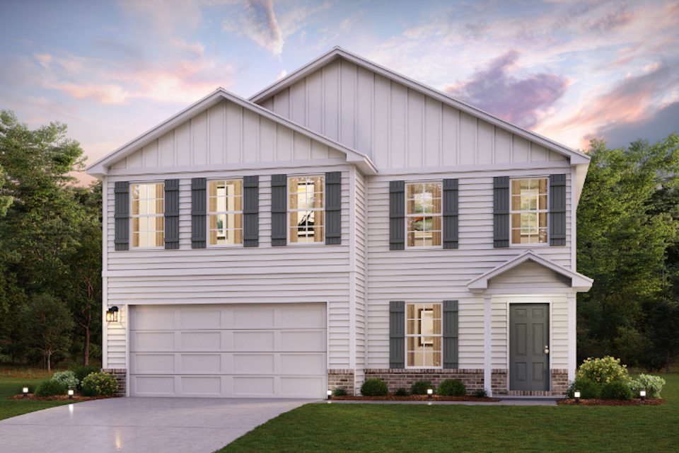 A white house with a garage.