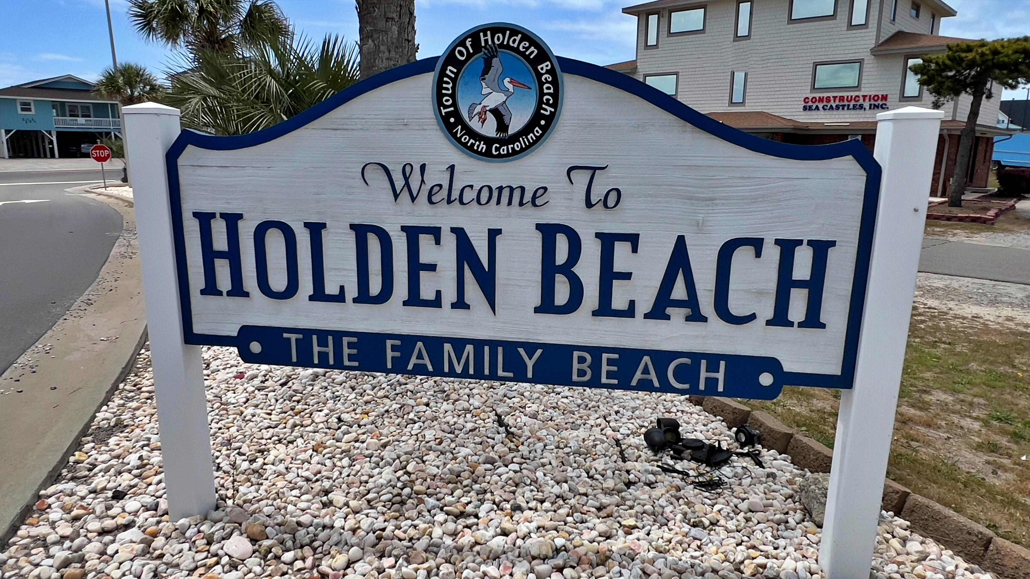 A sign on the side of a road.