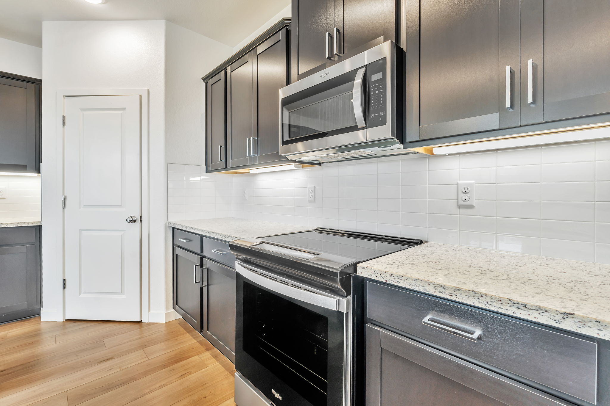 A kitchen with stainless steel appliances.